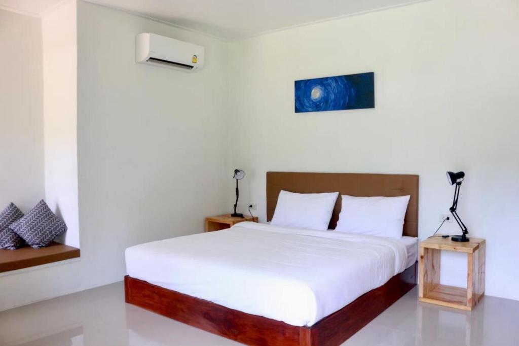 Postel nebo postele na pokoji v ubytování The Lodge at Koh Kood