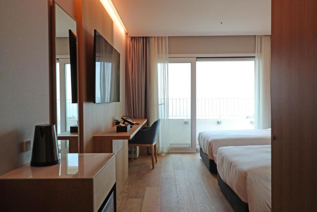 Postel nebo postele na pokoji v ubytování Haenam 126 Hotel