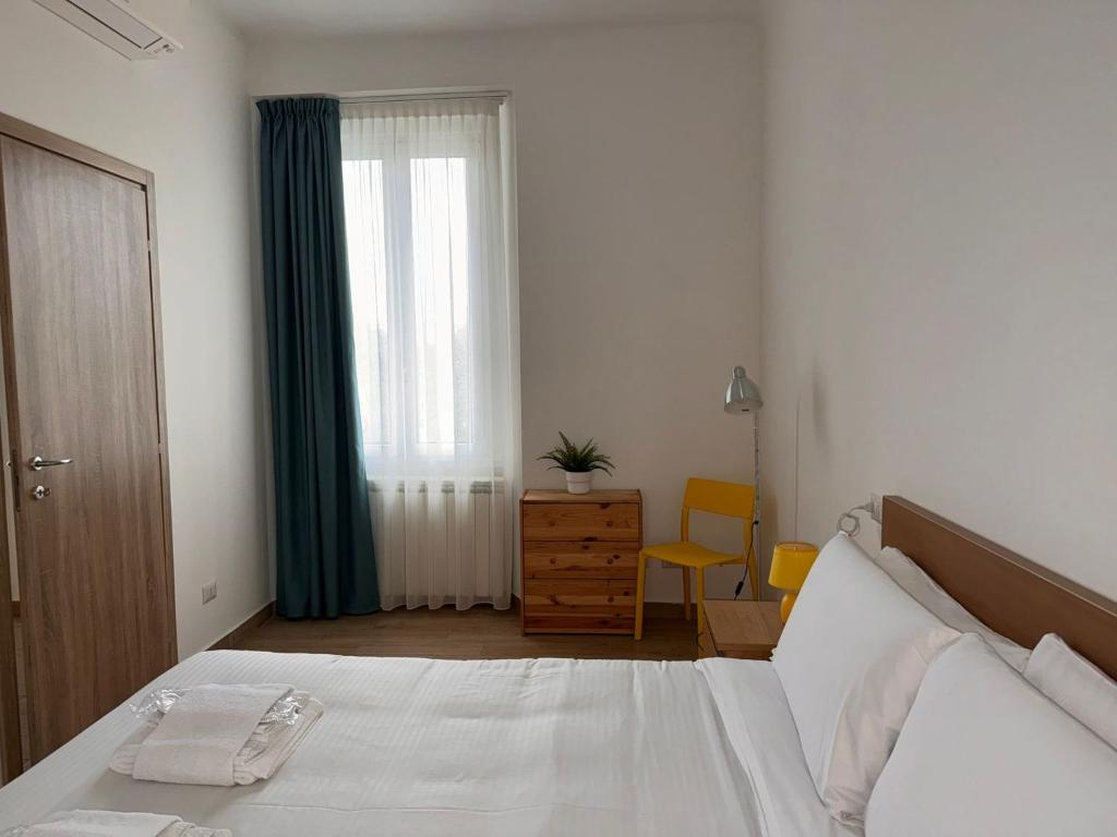 Postel nebo postele na pokoji v ubytování L'Archè Comfort & Relax Niguarda House