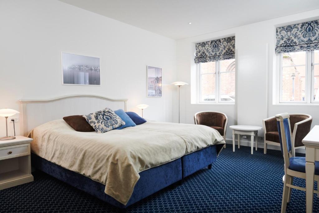 Postel nebo postele na pokoji v ubytování Tornøes Hotel