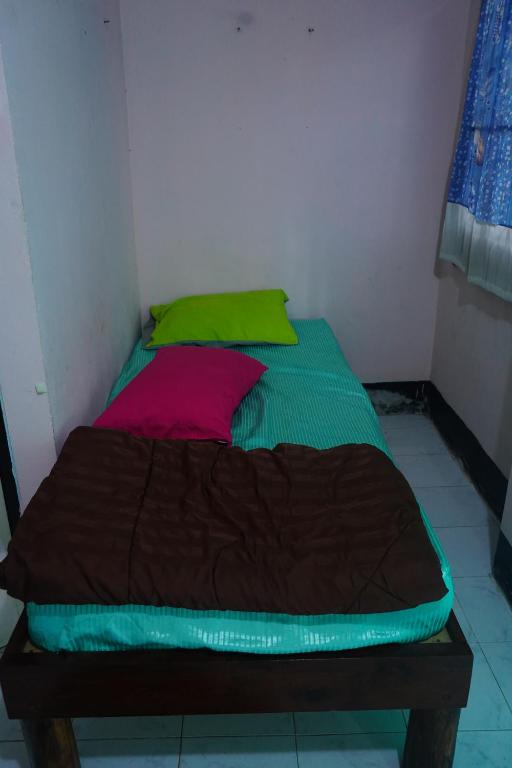Postel nebo postele na pokoji v ubytování Paifah Hostel