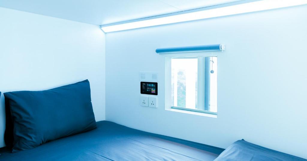 Letto o letti in una camera di Bobopod Thamrin, Jakarta