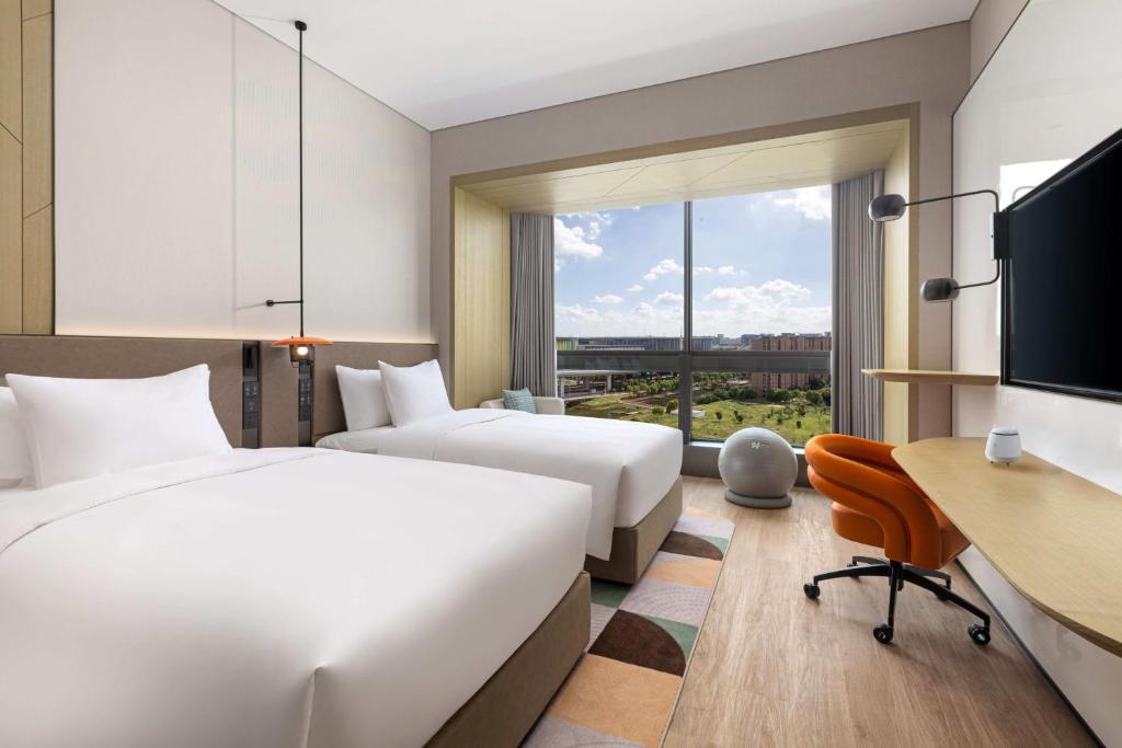 Postel nebo postele na pokoji v ubytování EVEN Hotel Shanghai Hongqiao CBD by IHG