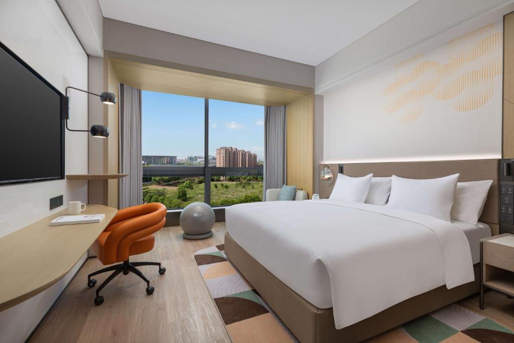 Postel nebo postele na pokoji v ubytování EVEN Hotel Shanghai Hongqiao CBD by IHG
