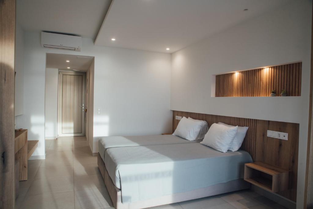 Postel nebo postele na pokoji v ubytování Hotel Athina