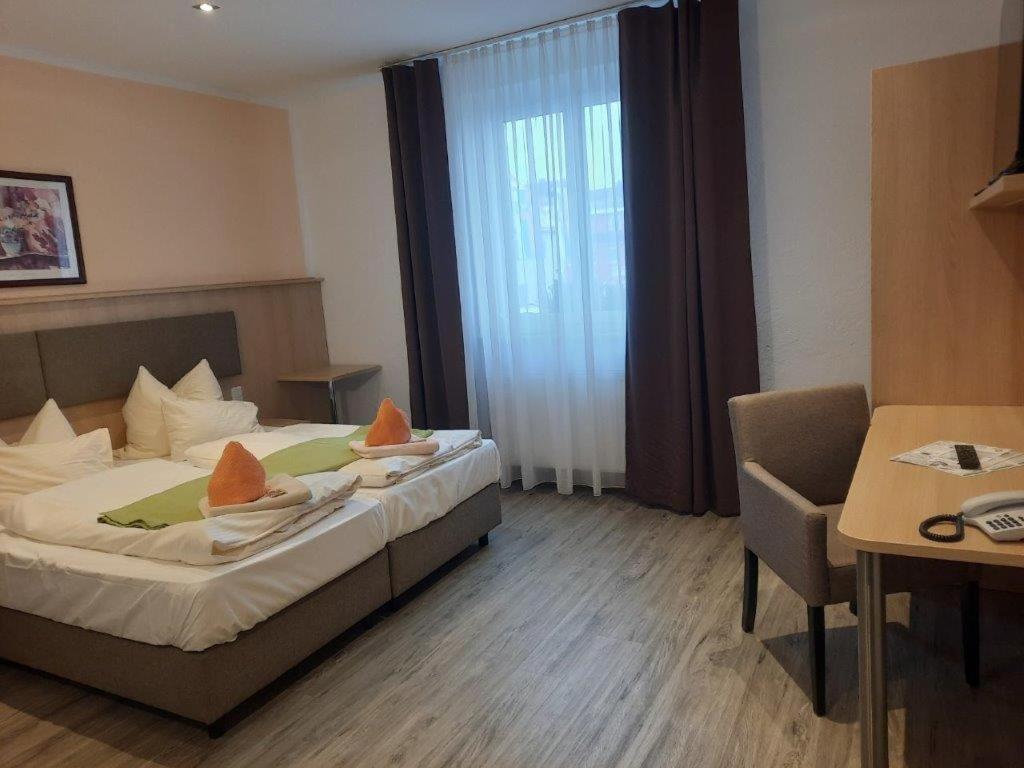Postel nebo postele na pokoji v ubytování Rathausstuben