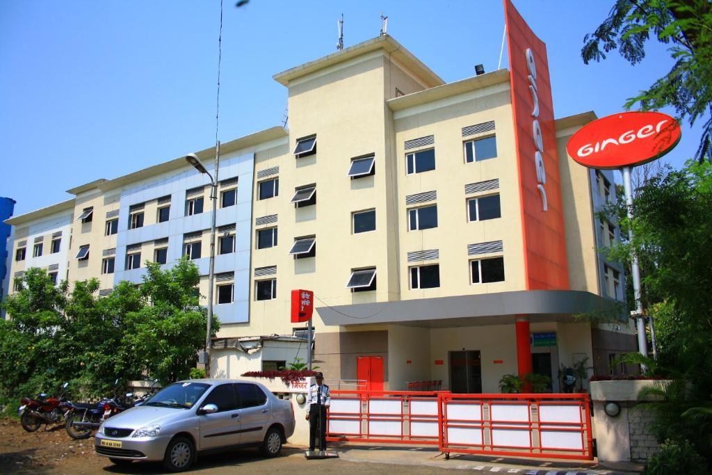 a car parked in front of a building at Ginger Pune - Pimpri in Pune