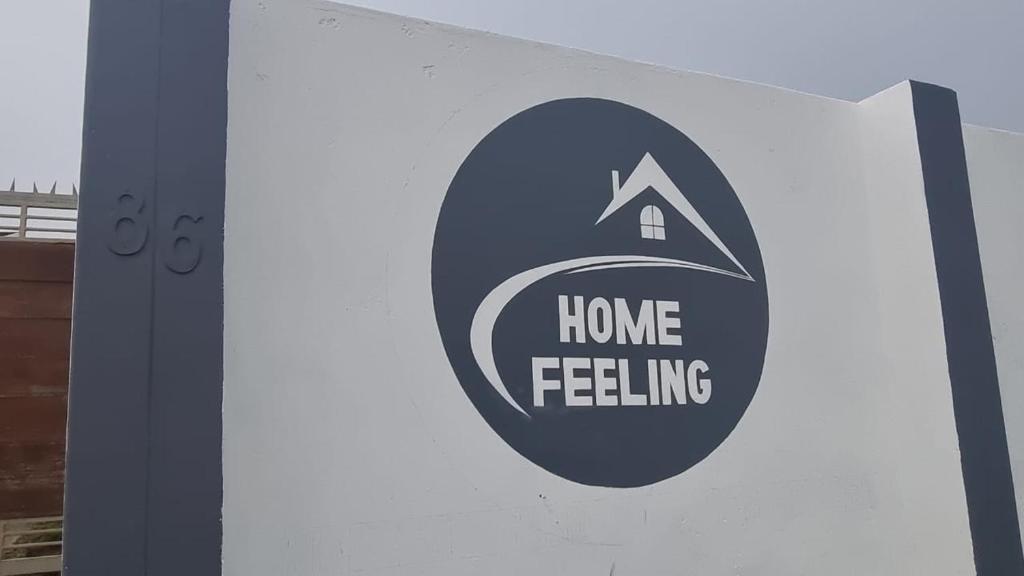 a sign that says home feeling on the side of a truck at Ugu Home Feeling Guesthouse in Port Shepstone