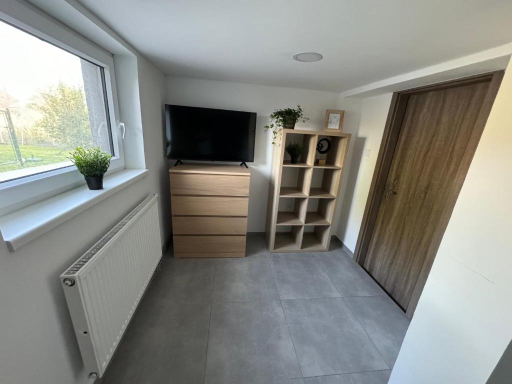 TV a/nebo společenská místnost v ubytování apartman 50m2 garden parking Free