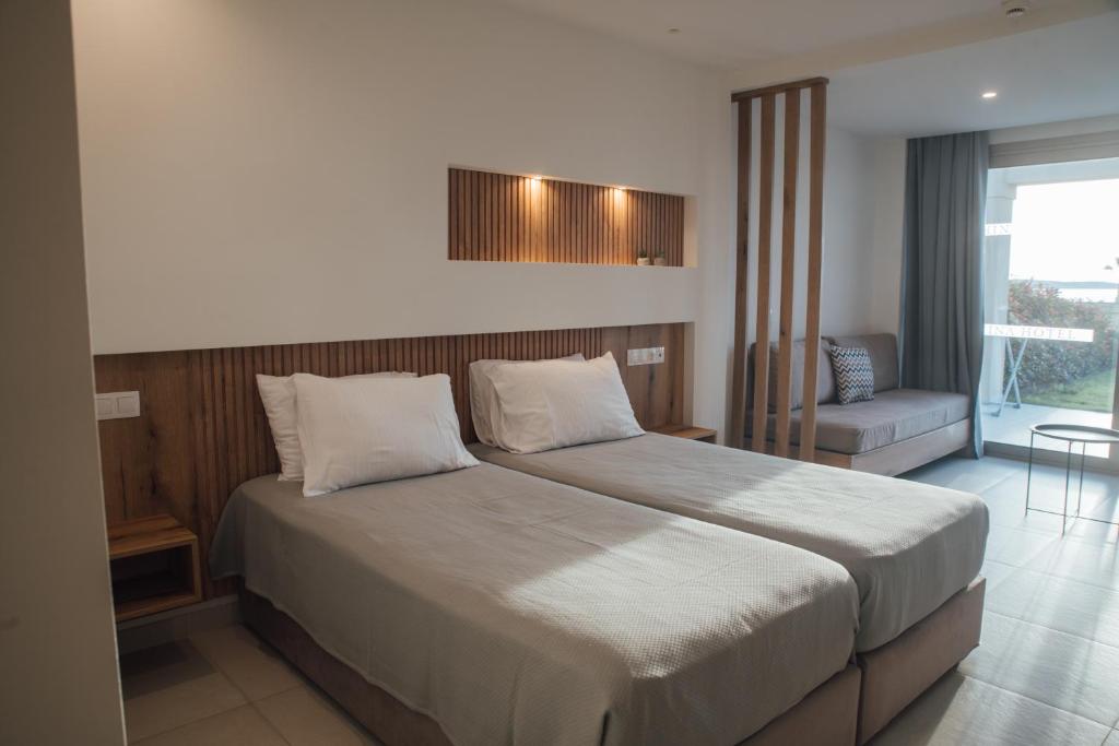 Postel nebo postele na pokoji v ubytování Hotel Athina