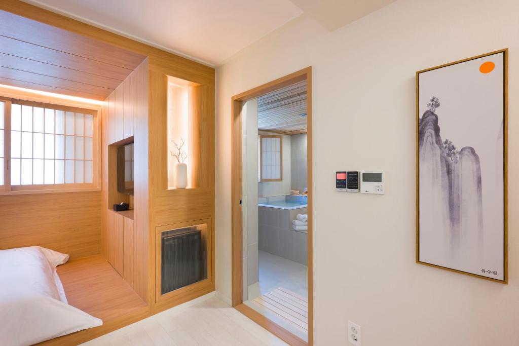 Postel nebo postele na pokoji v ubytování Hotel Yusurim