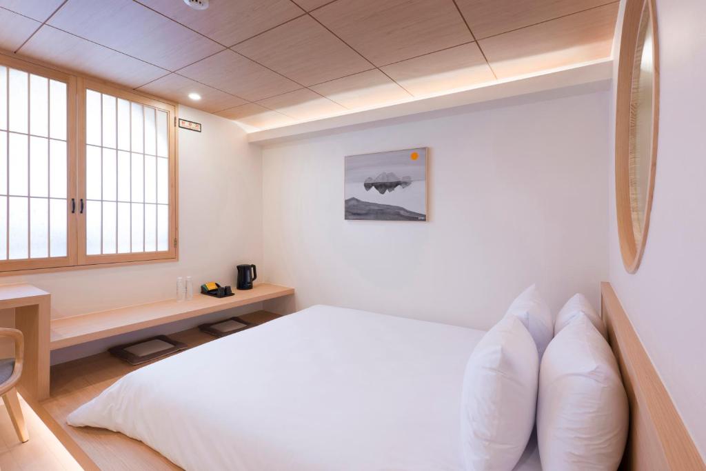 Postel nebo postele na pokoji v ubytování Hotel Yusurim
