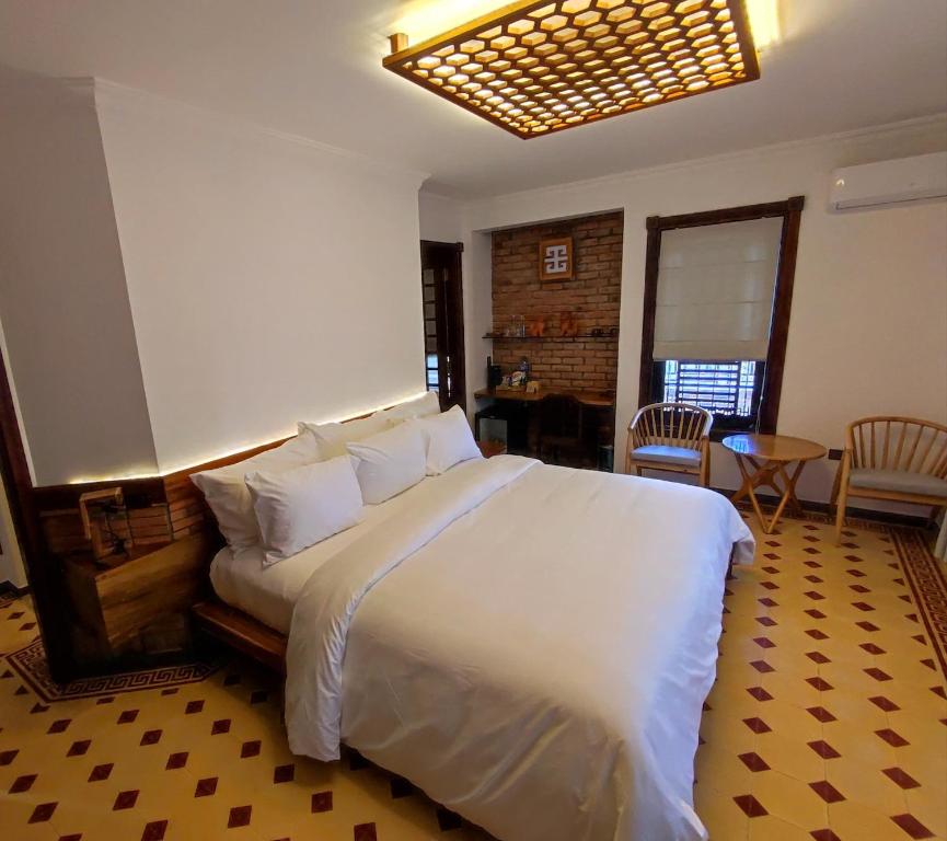 Postel nebo postele na pokoji v ubytování Gahi Homestay