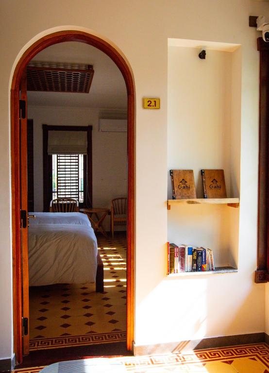 Postel nebo postele na pokoji v ubytování Gahi Homestay