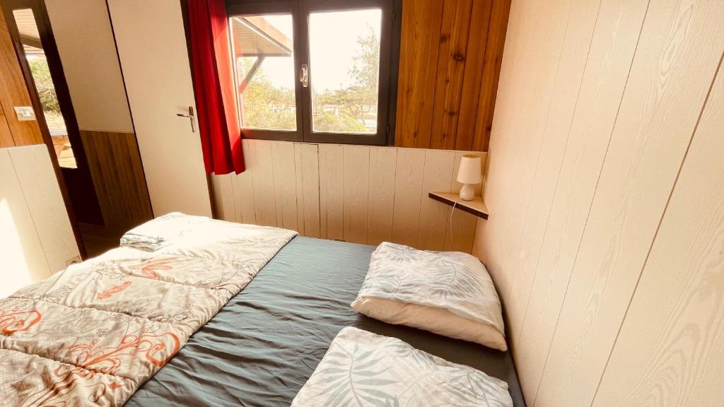 Postel nebo postele na pokoji v ubytování Camping Trinité