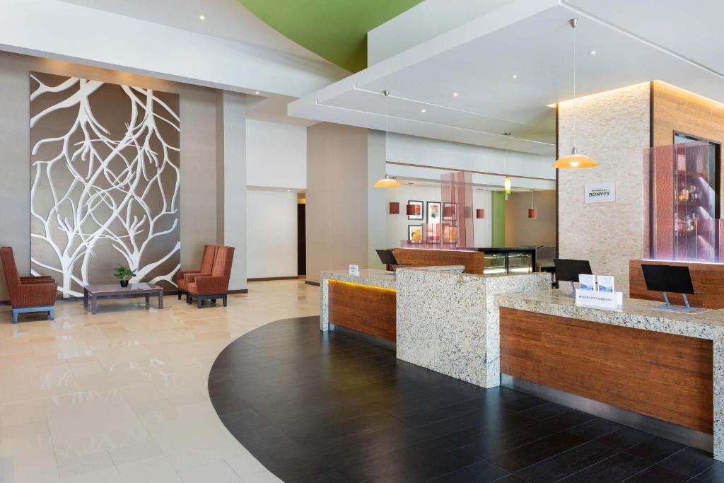a lobby of a hotel with a reception desk at Courtyard by Marriott Ciudad del Carmen Campeche in Ciudad del Carmen