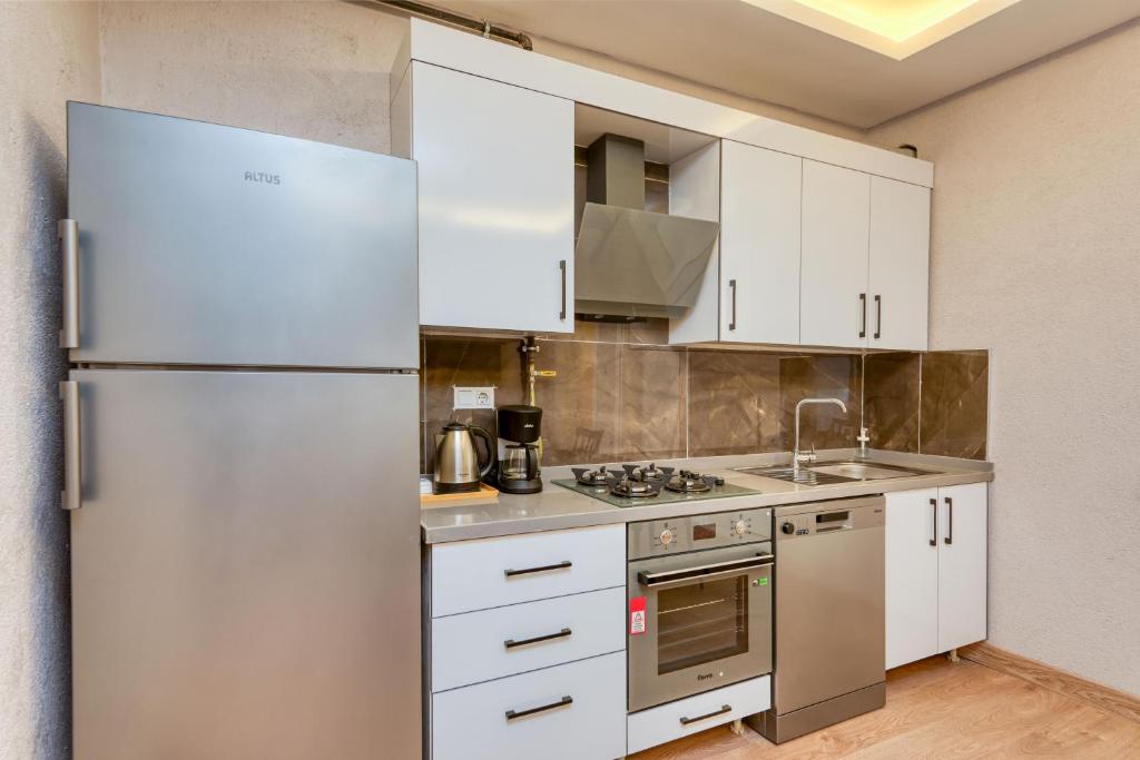 Kuchyň nebo kuchyňský kout v ubytování Port Apart Hotel