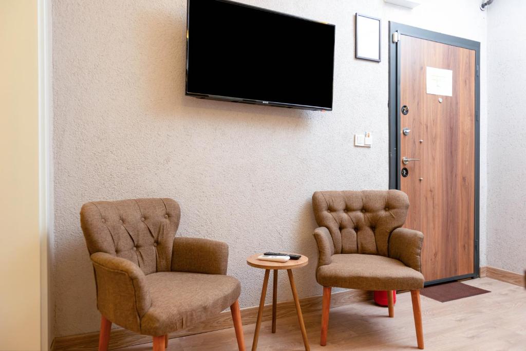 TV a/nebo společenská místnost v ubytování Port Apart Hotel