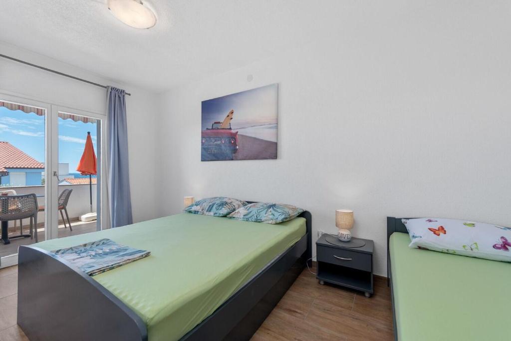 Postel nebo postele na pokoji v ubytování Apartment Uga2