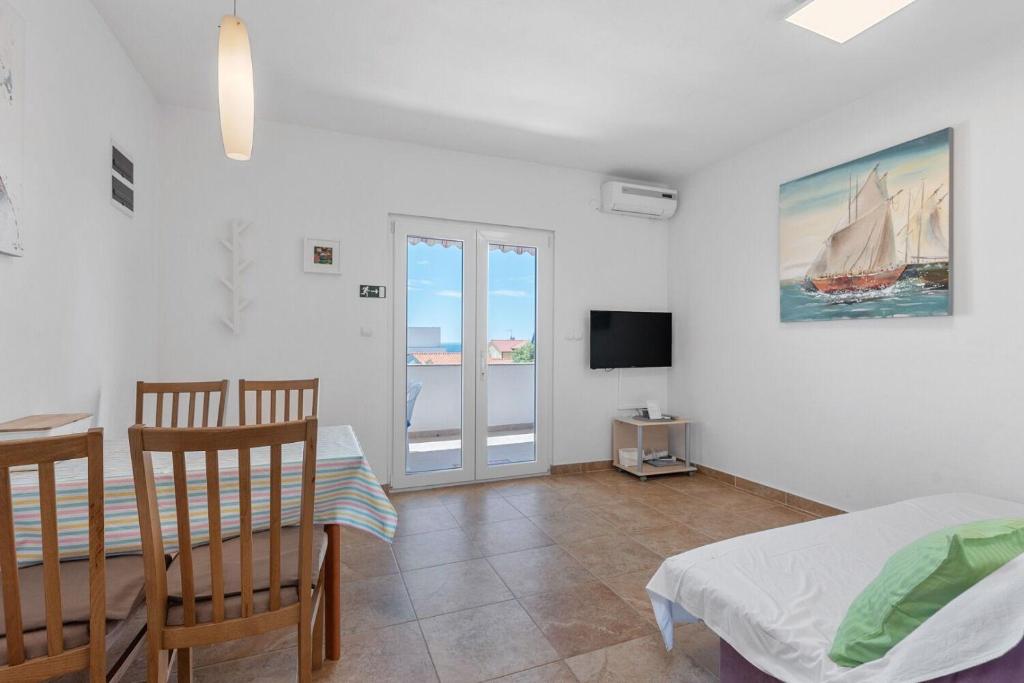 TV a/nebo společenská místnost v ubytování Apartment Uga2