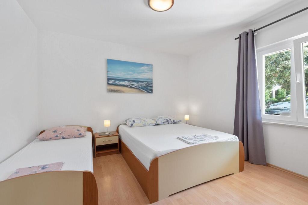 Postel nebo postele na pokoji v ubytování Apartment Uga2