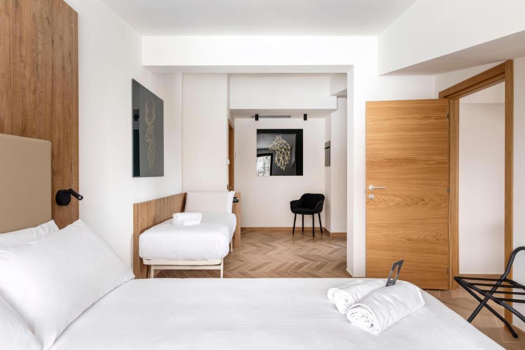Кровать или кровати в номере B&B Hotel Passo Tre Croci Cortina