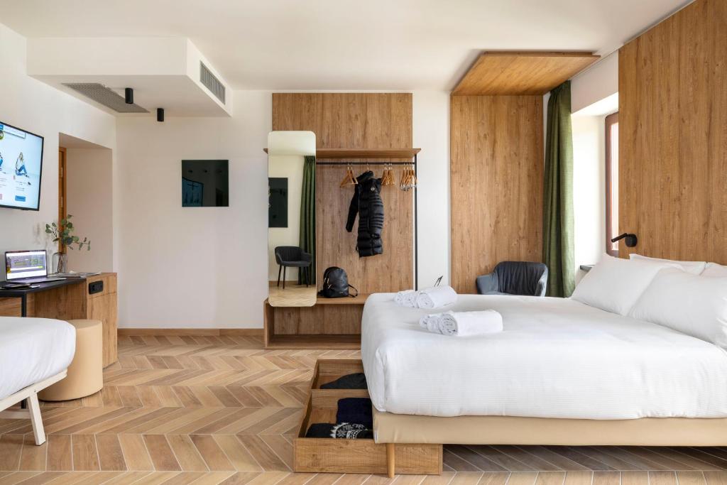 Телевизор и/или развлекательный центр в B&B Hotel Passo Tre Croci Cortina