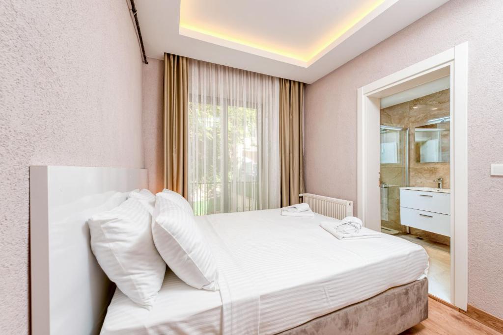 Postel nebo postele na pokoji v ubytování Port Apart Hotel