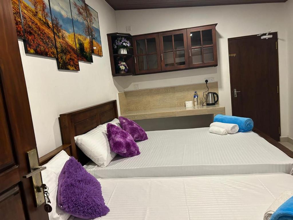 Postel nebo postele na pokoji v ubytování Dinu Lanka Resort