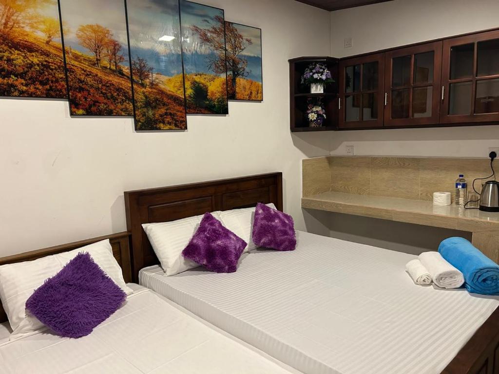 Postel nebo postele na pokoji v ubytování Dinu Lanka Resort