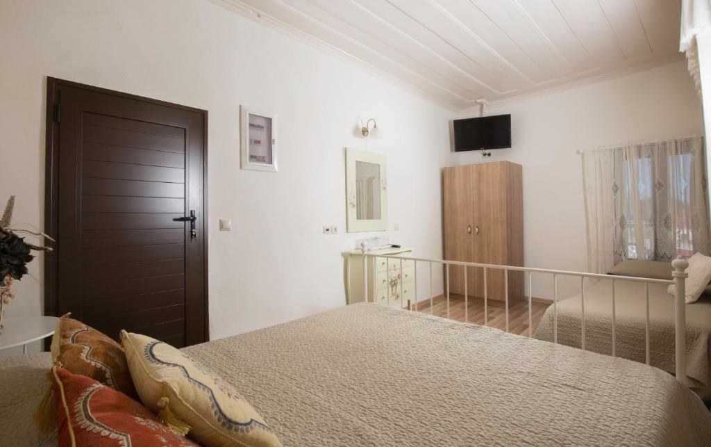 Postel nebo postele na pokoji v ubytování Evdokia Boutique Hotel