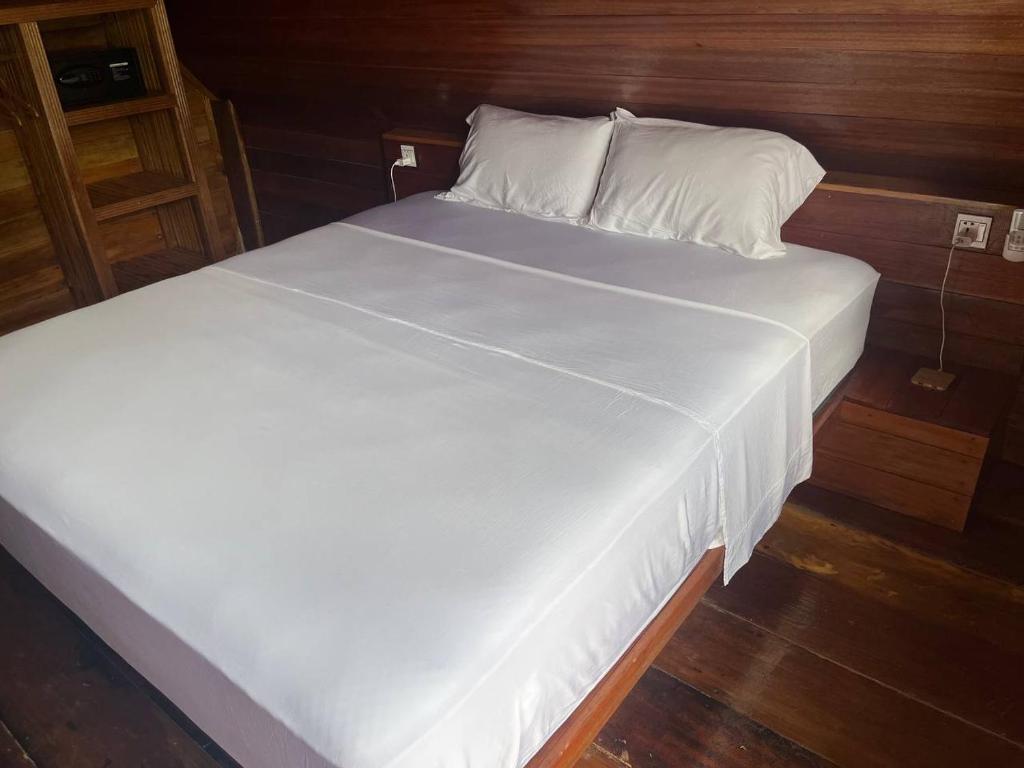 Postel nebo postele na pokoji v ubytování Coco Bungalows