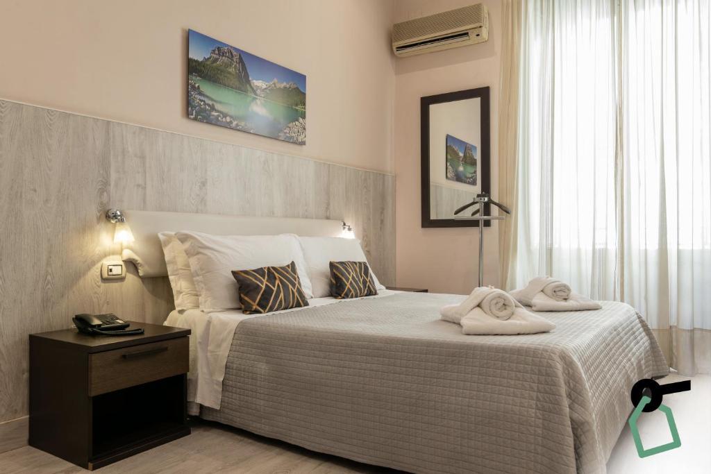 Postel nebo postele na pokoji v ubytování HOTIDAY Room Collection - Palermo Politeama