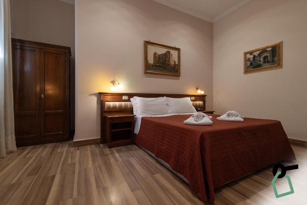 Postel nebo postele na pokoji v ubytování HOTIDAY Room Collection - Palermo Politeama