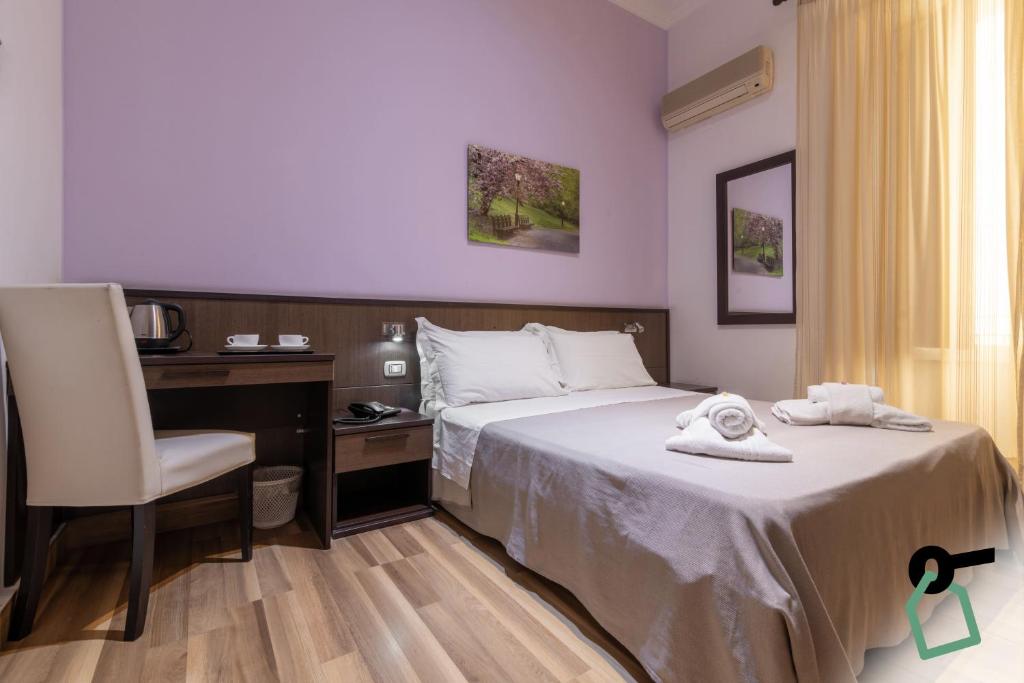 Postel nebo postele na pokoji v ubytování HOTIDAY Room Collection - Palermo Politeama