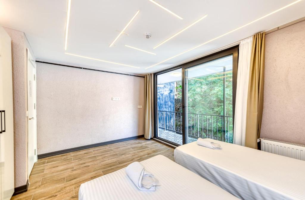 Postel nebo postele na pokoji v ubytování Port Apart Hotel