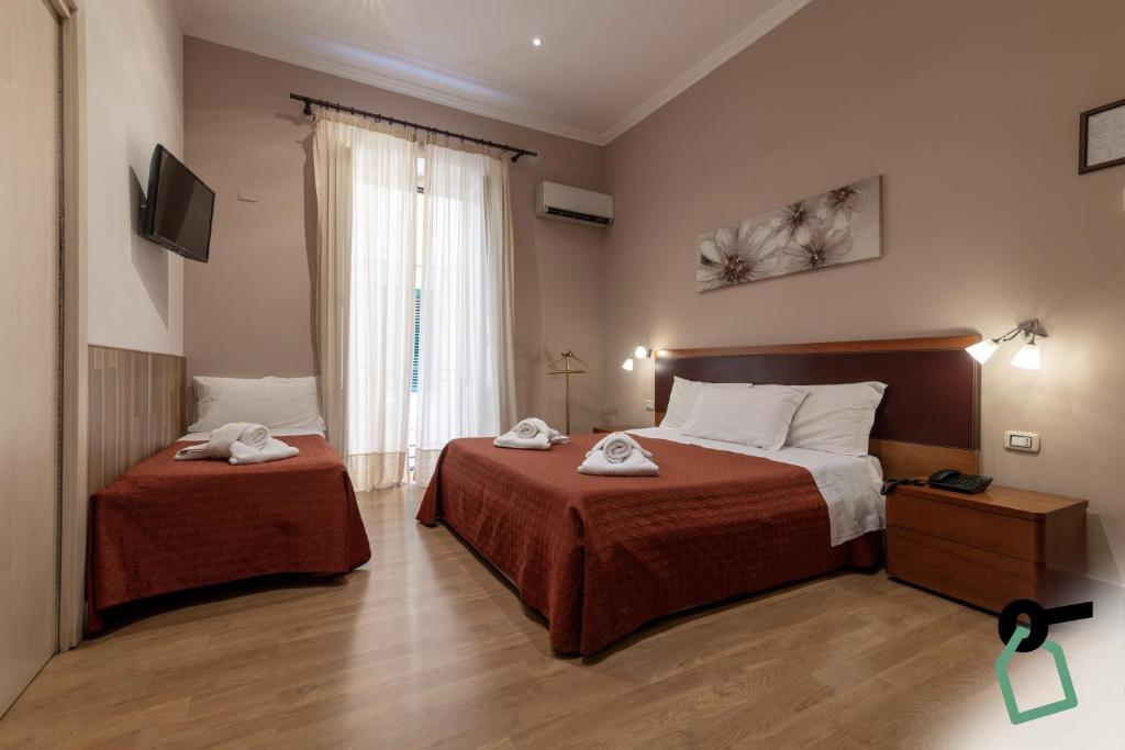 Postel nebo postele na pokoji v ubytování HOTIDAY Room Collection - Palermo Politeama