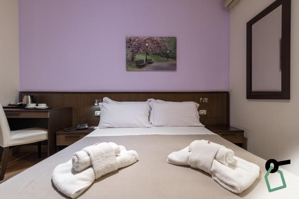 Postel nebo postele na pokoji v ubytování HOTIDAY Room Collection - Palermo Politeama