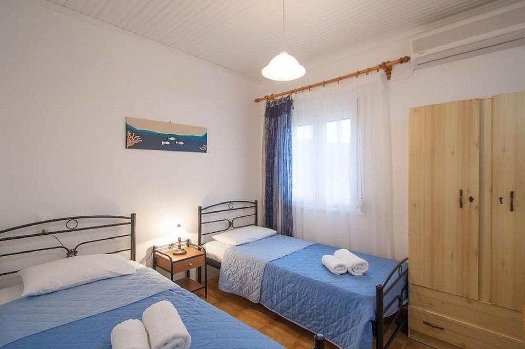 Postel nebo postele na pokoji v ubytování Villa ALEXIS