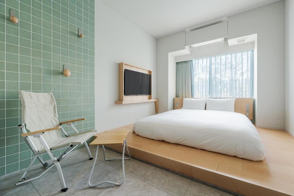 TV a/nebo společenská místnost v ubytování ITOMACHI Hotel 0