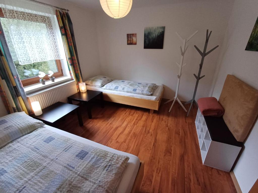 Postel nebo postele na pokoji v ubytování Ferienwohnung am Ulrichsgrünbach