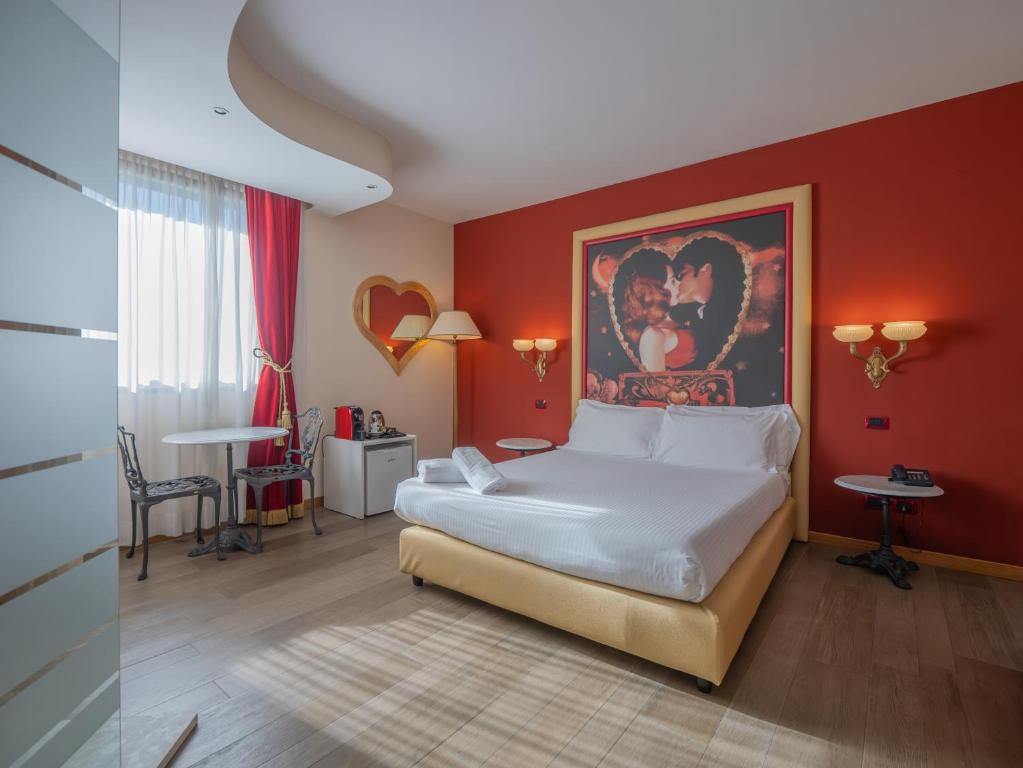 A bed or beds in a room at San Valentino Hotel