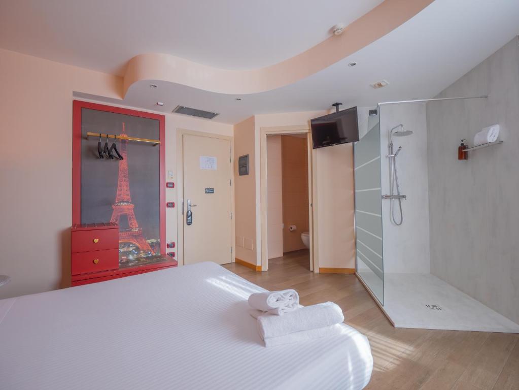 A bed or beds in a room at San Valentino Hotel