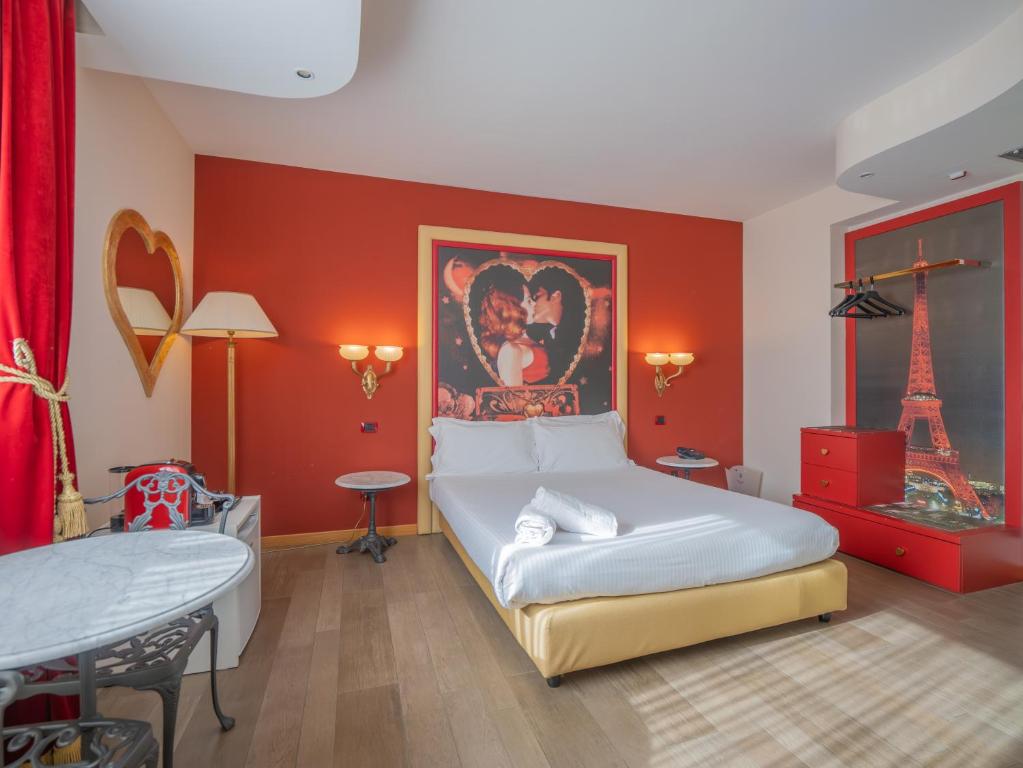 A bed or beds in a room at San Valentino Hotel