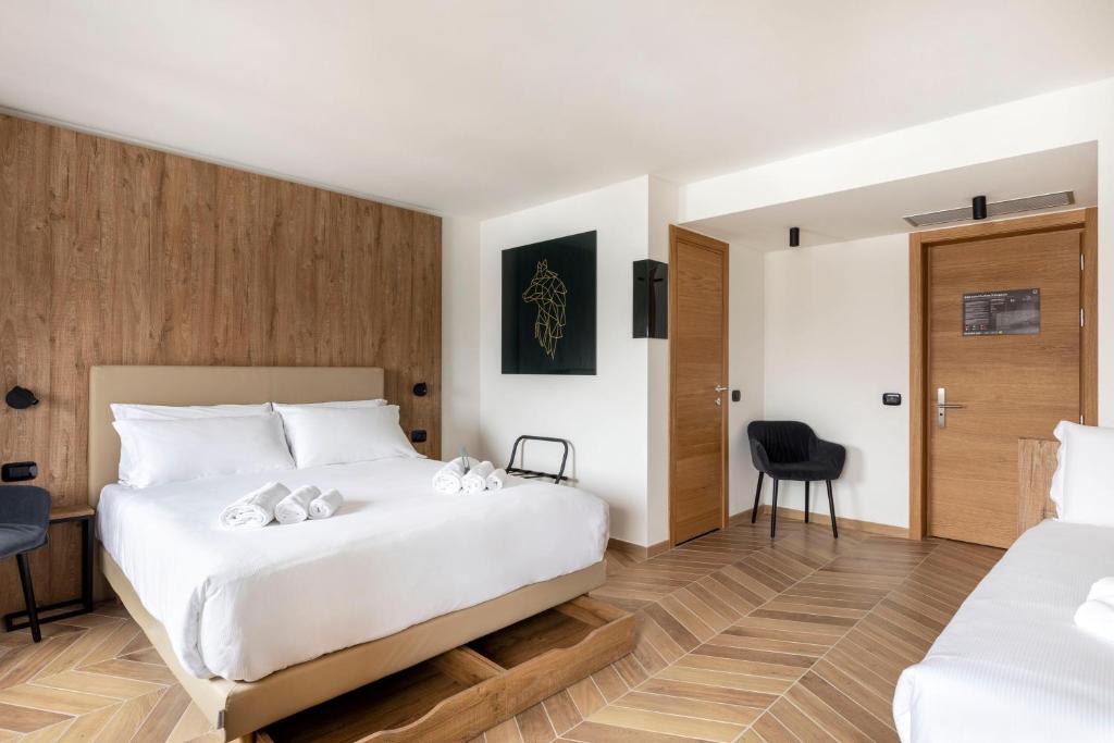 Кровать или кровати в номере B&B Hotel Passo Tre Croci Cortina