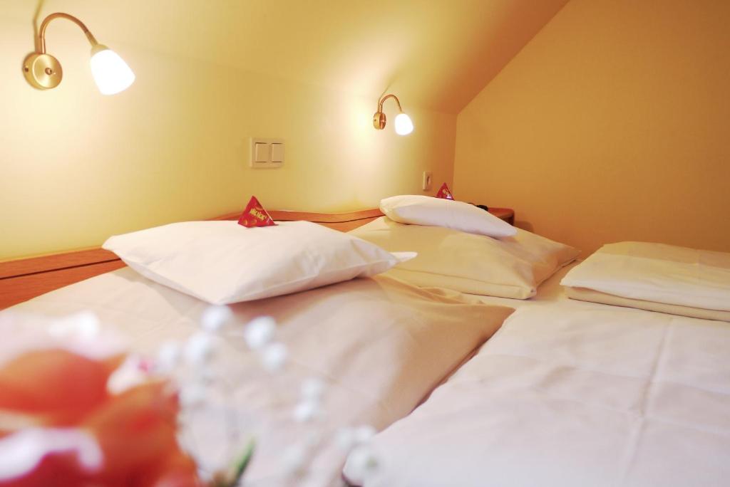 Postel nebo postele na pokoji v ubytování Da`Sporrer Hotel & Wirtshaus