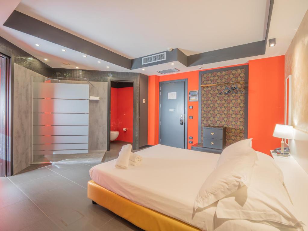 A bed or beds in a room at San Valentino Hotel