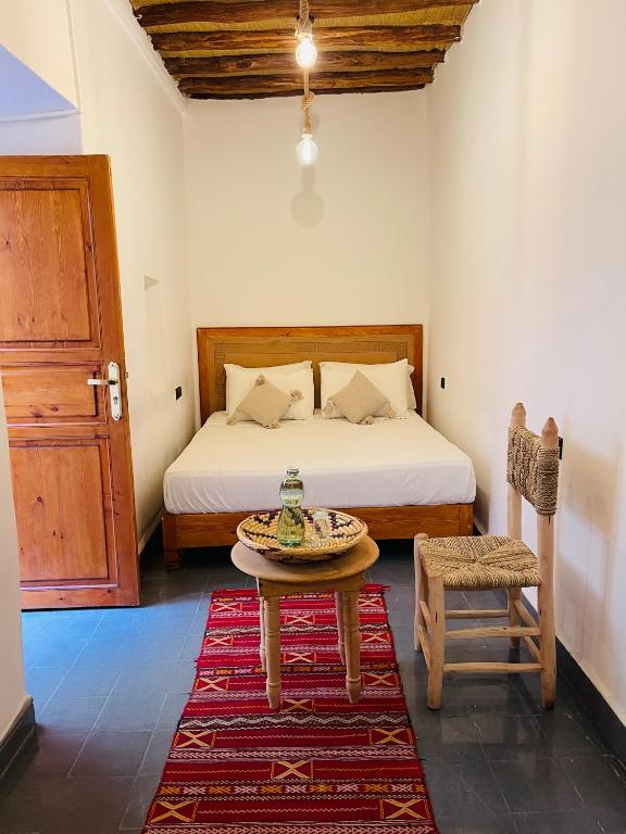 Postel nebo postele na pokoji v ubytování Riad La Calèche & SPA
