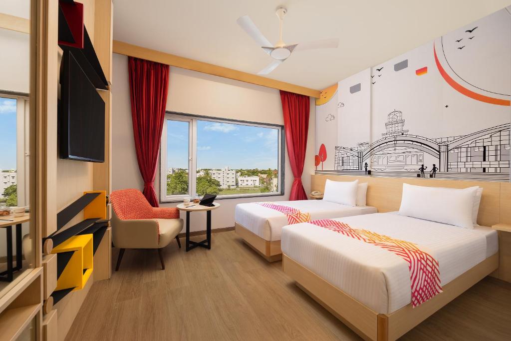 Postel nebo postele na pokoji v ubytování Ginger Coimbatore Airport , Avinashi Road