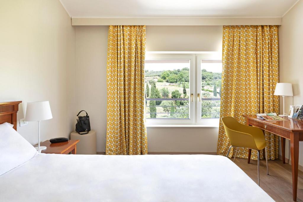 Letto o letti in una camera di B&B Hotel Affi - Lago di Garda